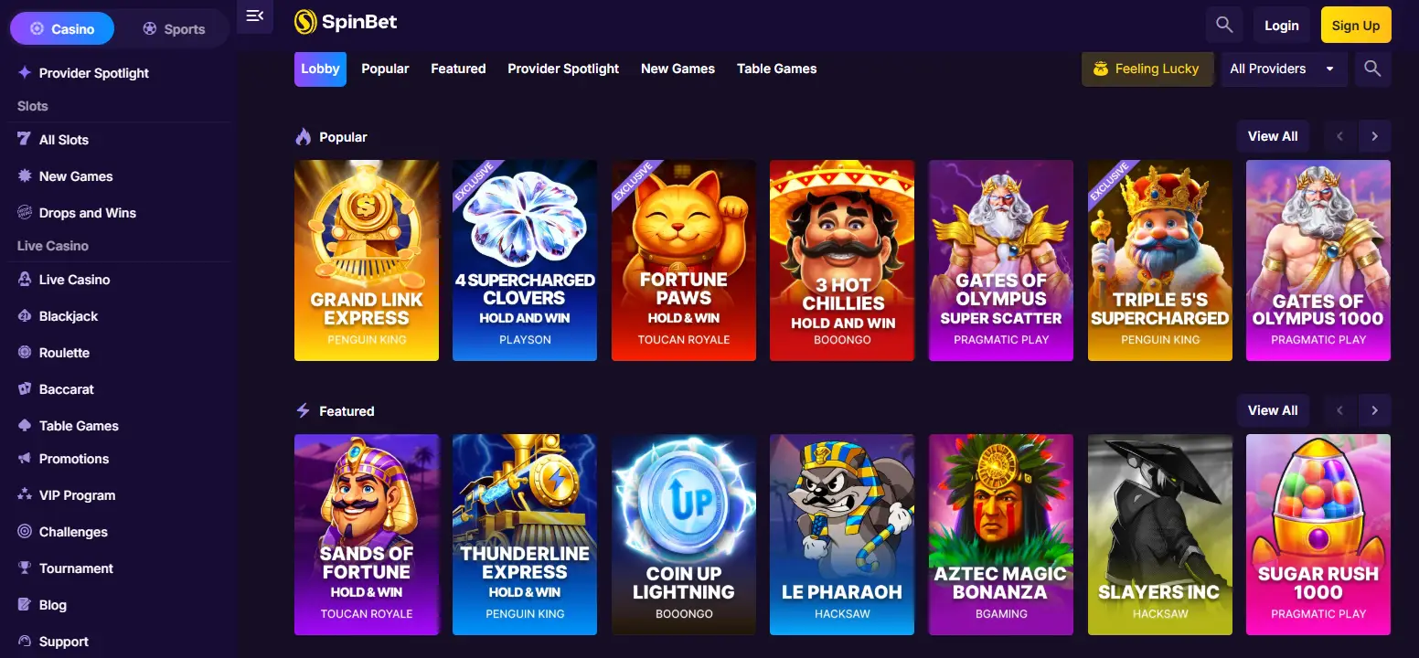 SpinBet casino lobby with popular and featured pokies from Pragmatic Play and Hacksaw